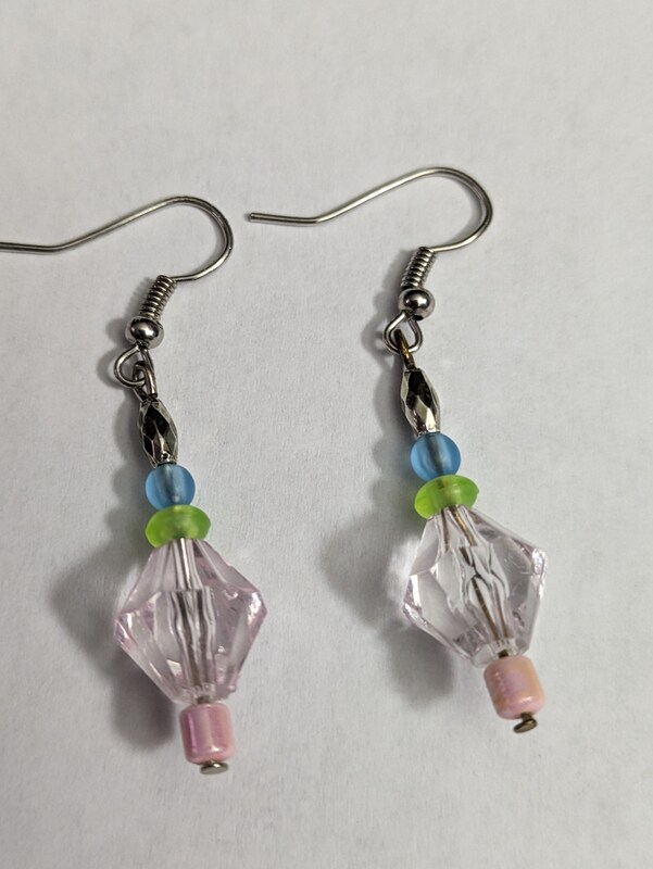 Pink and green dangle earrings with blue accent on fish hook ear wire